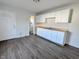 Kitchen area featuring white cabinets, new wood countertops and modern flooring at 408 E Beecher St, Indianapolis, IN 46225