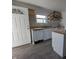 Kitchen features an island, stainless steel appliances, white cabinets, and wooden countertops at 408 E Beecher St, Indianapolis, IN 46225