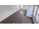 An empty living room space featuring hardwood flooring, white paint and natural lighting at 408 E Beecher St, Indianapolis, IN 46225