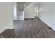 Bright living room featuring hardwood floors, fresh white paint, and staircase at 408 E Beecher St, Indianapolis, IN 46225