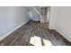 Spacious living room boasts wood-look floors and staircase at 408 E Beecher St, Indianapolis, IN 46225