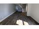 Large living room with hardwood flooring throughout and staircase at 408 E Beecher St, Indianapolis, IN 46225