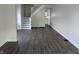 An empty living room with new wood floors and a staircase at 408 E Beecher St, Indianapolis, IN 46225