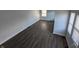 Empty living room features wood flooring and ample natural light at 408 E Beecher St, Indianapolis, IN 46225