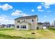 Lush backyard features a two-story house with beige siding and well-manicured lawn at 4087 Railhead Ave, Westfield, IN 46074