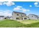 Spacious backyard featuring lush lawn and a two-story house with neutral siding at 4087 Railhead Ave, Westfield, IN 46074