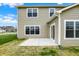 View of backyard patio and siding on a two-story home with large windows at 4087 Railhead Ave, Westfield, IN 46074