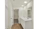 This bathroom boasts a double sink vanity with modern fixtures, a large mirror, and a walk-in closet at 4087 Railhead Ave, Westfield, IN 46074