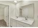 This bathroom boasts a double sink vanity with modern fixtures, a large mirror, and a walk-in closet at 4087 Railhead Ave, Westfield, IN 46074