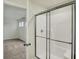 This bathroom showcases a glass-enclosed shower with modern fixtures, and a door leading to the bedroom at 4087 Railhead Ave, Westfield, IN 46074