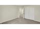 A well-lit bedroom features neutral walls, carpet, and closet doors leading to other rooms at 4087 Railhead Ave, Westfield, IN 46074