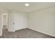 Bright bedroom with neutral walls, carpet, and closet doors offering ample storage space at 4087 Railhead Ave, Westfield, IN 46074