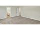 This bedroom features plush carpeting, neutral paint, and doors leading to a bathroom and another room at 4087 Railhead Ave, Westfield, IN 46074