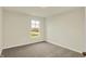 This bedroom features neutral walls, carpet, and a window providing natural light at 4087 Railhead Ave, Westfield, IN 46074