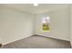 This bedroom has neutral walls, carpet, and a window that provides natural light to the room at 4087 Railhead Ave, Westfield, IN 46074
