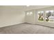 This bedroom features plush carpeting, multiple windows offering ample natural light, and neutral paint at 4087 Railhead Ave, Westfield, IN 46074