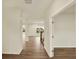 Hallway with wood floors and view of stairs, and view of other rooms creating an inviting entrance at 4087 Railhead Ave, Westfield, IN 46074