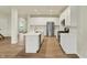 Modern kitchen with white cabinets, stainless steel appliances, and a large island at 4087 Railhead Ave, Westfield, IN 46074