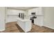 Spacious kitchen with white cabinetry, stainless appliances, and a central island at 4087 Railhead Ave, Westfield, IN 46074