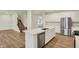 Modern kitchen featuring white cabinets, stainless steel appliances, and a large island at 4087 Railhead Ave, Westfield, IN 46074