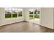 Bright living room with wood flooring, large windows and sliding glass door at 4087 Railhead Ave, Westfield, IN 46074