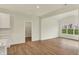 Open concept living space featuring wood floors, large windows, and a pantry at 4087 Railhead Ave, Westfield, IN 46074