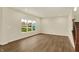 Living room featuring wood floors and windows with a view of the community at 4087 Railhead Ave, Westfield, IN 46074