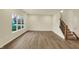 Living room featuring wood floors, recessed lighting, windows and a staircase at 4087 Railhead Ave, Westfield, IN 46074