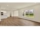 Open floor plan featuring hardwood floors with a kitchen, pantry and view of the community at 4087 Railhead Ave, Westfield, IN 46074