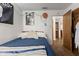 Cozy bedroom featuring a comfortable bed and unique wall decor, creating a personalized space at 409 W Pike St, Martinsville, IN 46151