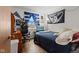 Bedroom with blue walls, hardwood floors, and a lively decor; sports and music themed at 409 W Pike St, Martinsville, IN 46151