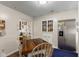 Functional kitchen with white cabinets, stainless steel refrigerator, and cozy dining area at 409 W Pike St, Martinsville, IN 46151