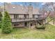 Spacious backyard features a multi-level deck, mature trees, and lush landscaping providing an outdoor living space at 454 Roberson Blvd, Mooresville, IN 46158