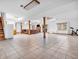 Spacious finished basement with tile flooring, wooden support beams, a fireplace and ample open space at 454 Roberson Blvd, Mooresville, IN 46158