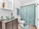 Bathroom featuring vanity with vessel sink, mirrored medicine cabinet, toilet, and shower with curtain at 454 Roberson Blvd, Mooresville, IN 46158