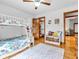 Cozy bedroom featuring a bunk bed, hardwood floors, a decorative rug and walk-in closet at 454 Roberson Blvd, Mooresville, IN 46158