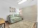 Comfortable bedroom featuring a daybed, wall art, wood-look floors and accent wood-look paneling at 454 Roberson Blvd, Mooresville, IN 46158