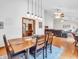 An open-concept dining room with pendant lighting, table, and seating adjacent to living area at 454 Roberson Blvd, Mooresville, IN 46158