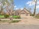 Charming brick home with well-manicured lawn, mature trees, and a spacious three-car garage at 454 Roberson Blvd, Mooresville, IN 46158