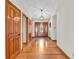 Elegant foyer with hardwood floors and a grand wooden front door with decorative glass at 454 Roberson Blvd, Mooresville, IN 46158