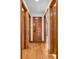 Hallway featuring hardwood floors and multiple paneled doors leading to different rooms at 454 Roberson Blvd, Mooresville, IN 46158