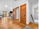 Bright hallway with hardwood floors and natural light streaming through the living room at 454 Roberson Blvd, Mooresville, IN 46158