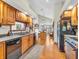 Traditional kitchen with wooden cabinets, modern appliances, hardwood floors and an eat-in island at 454 Roberson Blvd, Mooresville, IN 46158