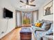 Comfortable living room with hardwood floors, a sofa, and a view of the outdoors at 454 Roberson Blvd, Mooresville, IN 46158