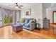 Cozy living room with a gray sofa, ottoman, and a large window at 454 Roberson Blvd, Mooresville, IN 46158