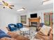 Cozy living room with a beautiful fireplace and large windows providing an abundance of natural light at 454 Roberson Blvd, Mooresville, IN 46158