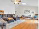 Cozy living room with hardwood floors, comfortable sectional sofa, and natural light at 454 Roberson Blvd, Mooresville, IN 46158