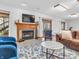 Living room space with fireplace, natural light, and easy access to an outdoor patio at 454 Roberson Blvd, Mooresville, IN 46158