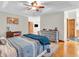 Spacious main bedroom featuring hardwood floors, ceiling fan and an en-suite bathroom at 454 Roberson Blvd, Mooresville, IN 46158