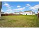 A spacious backyard with a well-maintained lawn, enclosed by a privacy fence at 5374 Marigold Dr, Plainfield, IN 46168